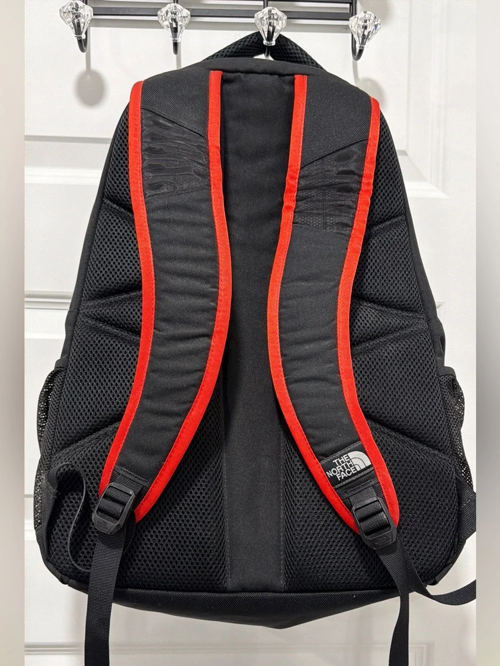 The North Face Haystack Backpack Vertical logo Black and Red